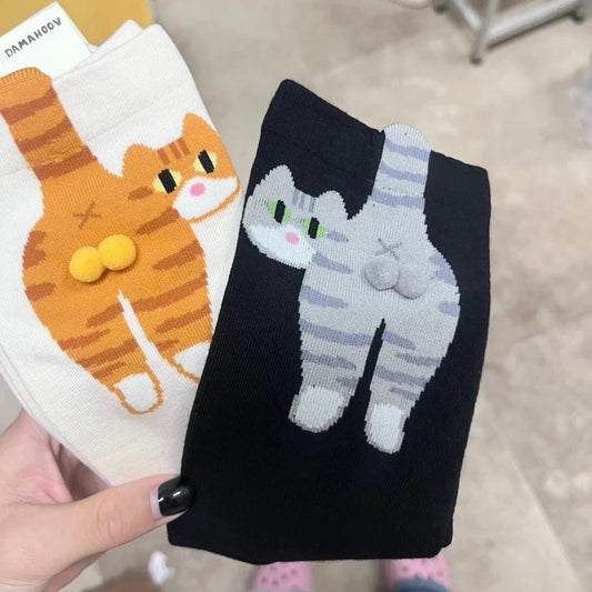 Funny cat butt socks with 3D tails and pom-poms, one orange tabby, one grey tabby design